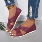 Flache Sandalen mit gekreuzten Riemen und Knoten